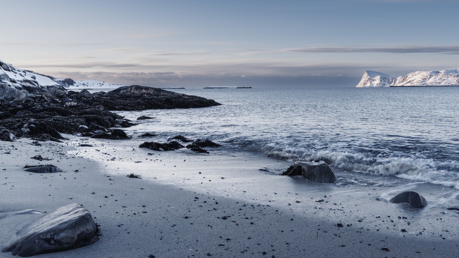Coastal road and fjord landscape on the way to Sommarøy, Norway
